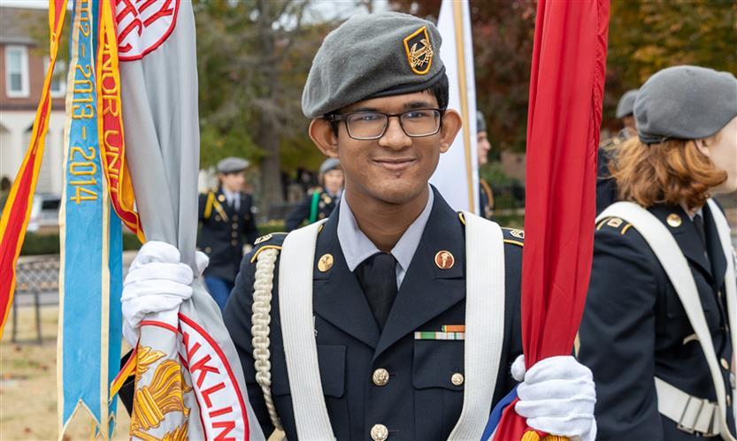 Students march in a Veterans Day Parade